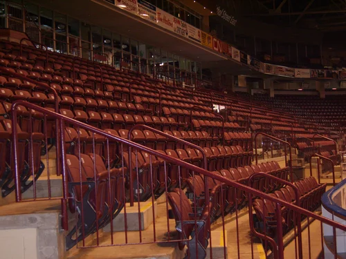 Painted tubular steel handrails and aisle guards in a seating bowl